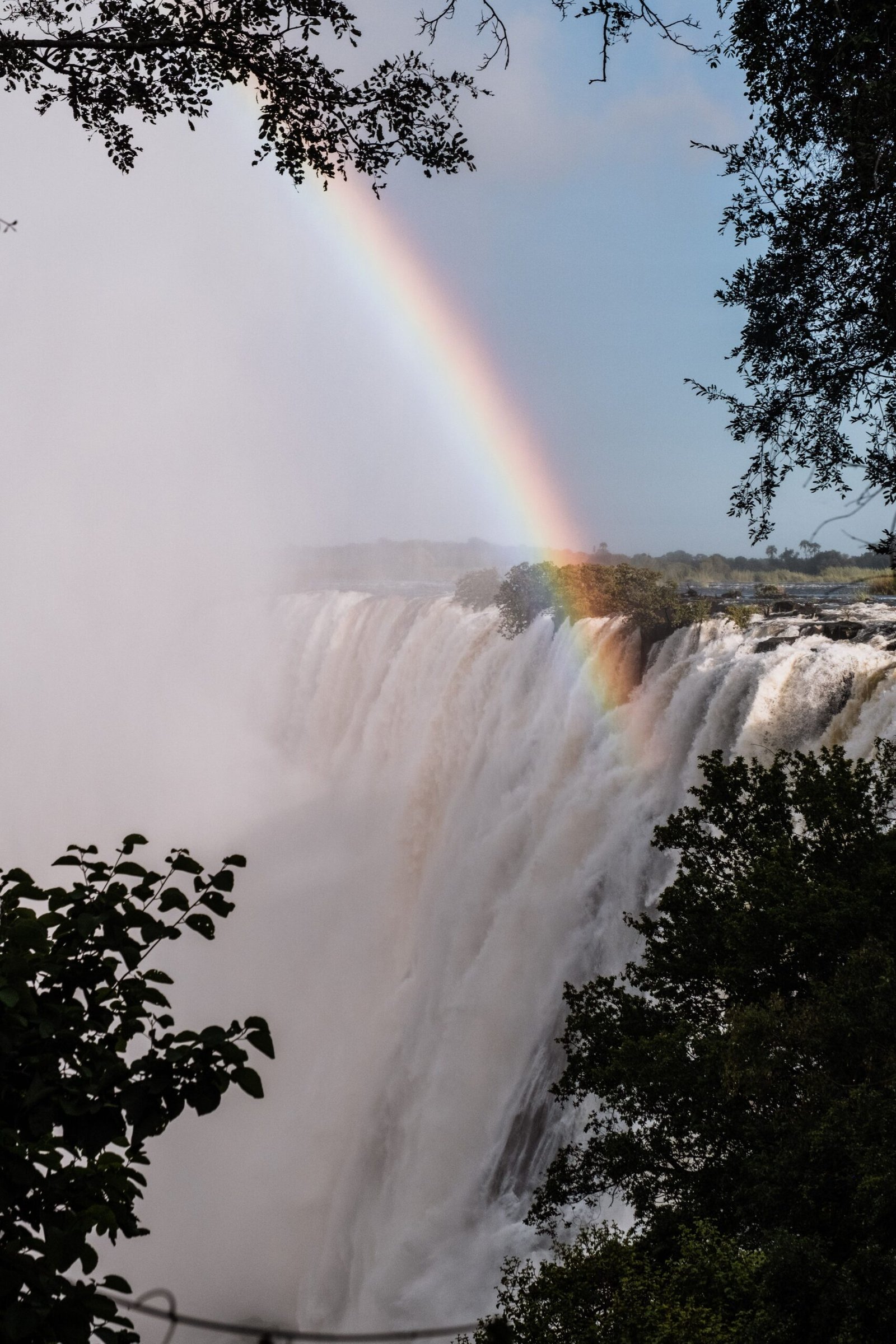 Aerial view of the Zambezi River plunging over Victoria Falls into deep gorges